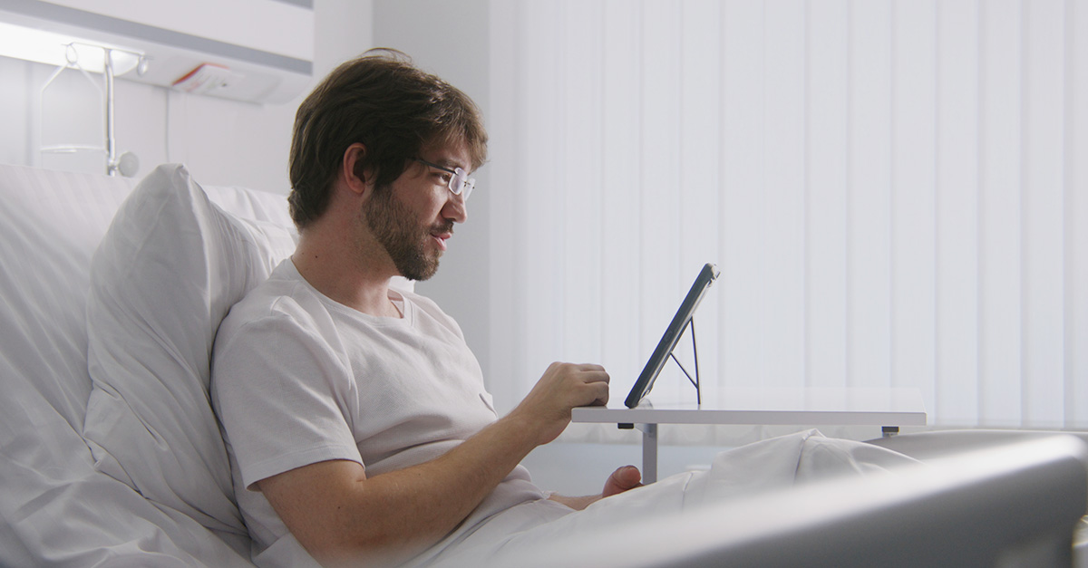 patient filling out survey on a tablet